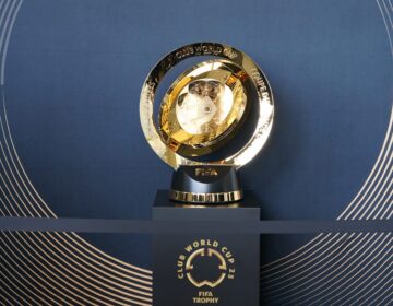 The trophy sits on a pedastal